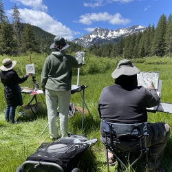 Students painting in the field