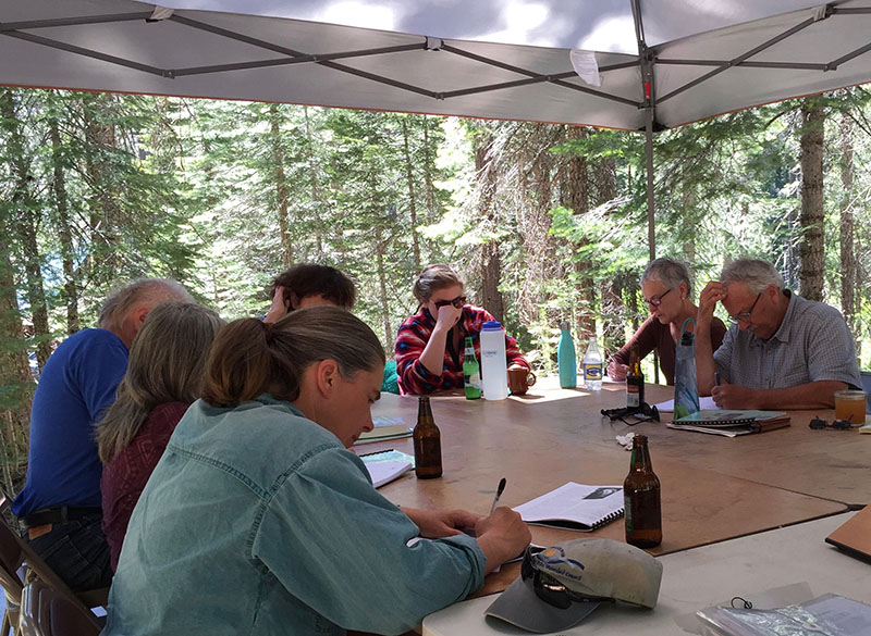 writers at a table at Sierra Nevada Field Campus